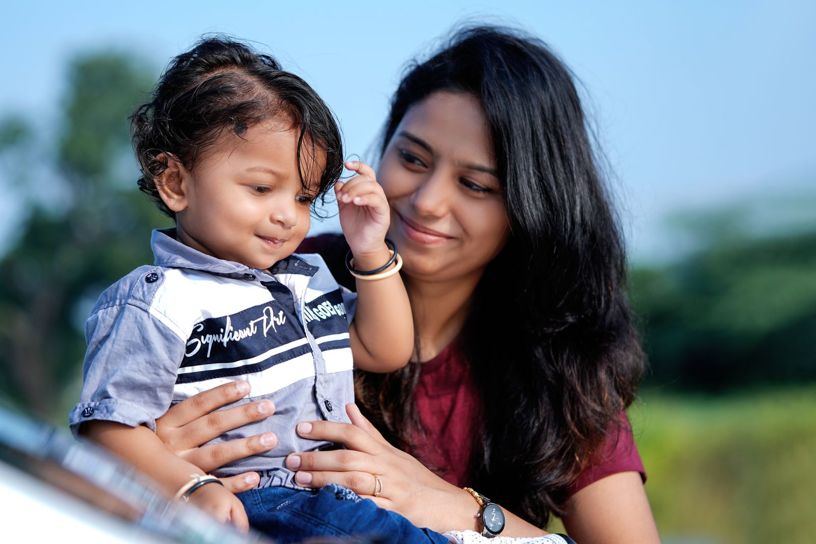Mother with a young son in a close, attentive interaction